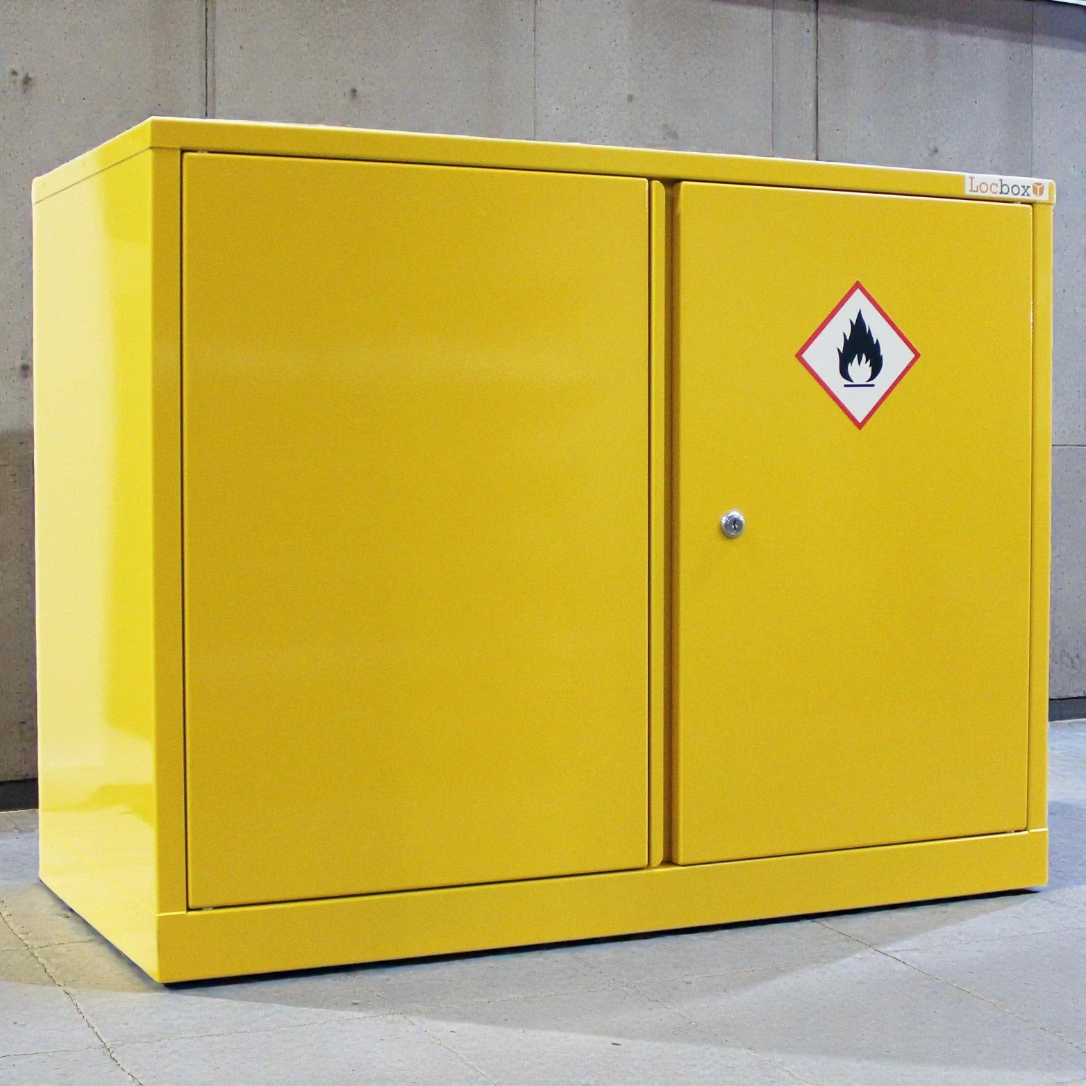 Yellow CoSHH cabinet in an organised rural farm workshop